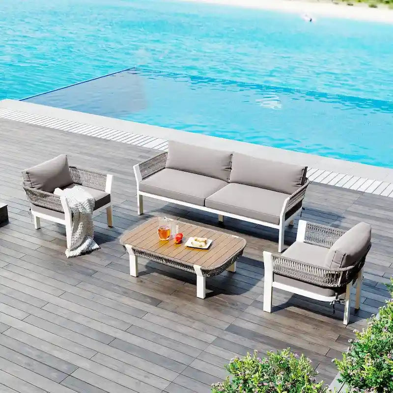 Ensemble de conversation extérieur 4 pièces avec table basse et coussins moelleux