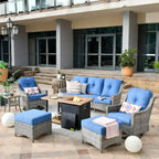 Ensemble de 7 chaises pivotantes incurvées en osier d'extérieur OVIOS avec table de feu