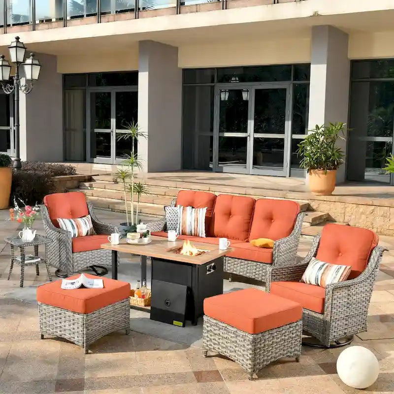 Ensemble de 7 chaises pivotantes incurvées en osier d'extérieur OVIOS avec table de feu