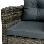 Ensemble de conversation extérieur 3 pièces avec fauteuil pivotant et coussins en rotin.